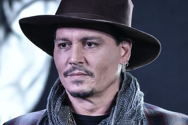 Johnny Depp flashes cowboy-look to glam up 'Master Carnival' during first Hainan International Film Festival